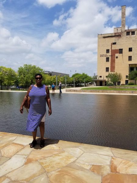 Dr Vanessa Scott-Thompson stands before the Oklahoma City Memorial Museum Reflection Pool