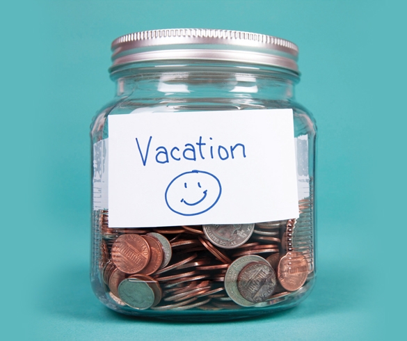 Jar labeled vacation filled with money.