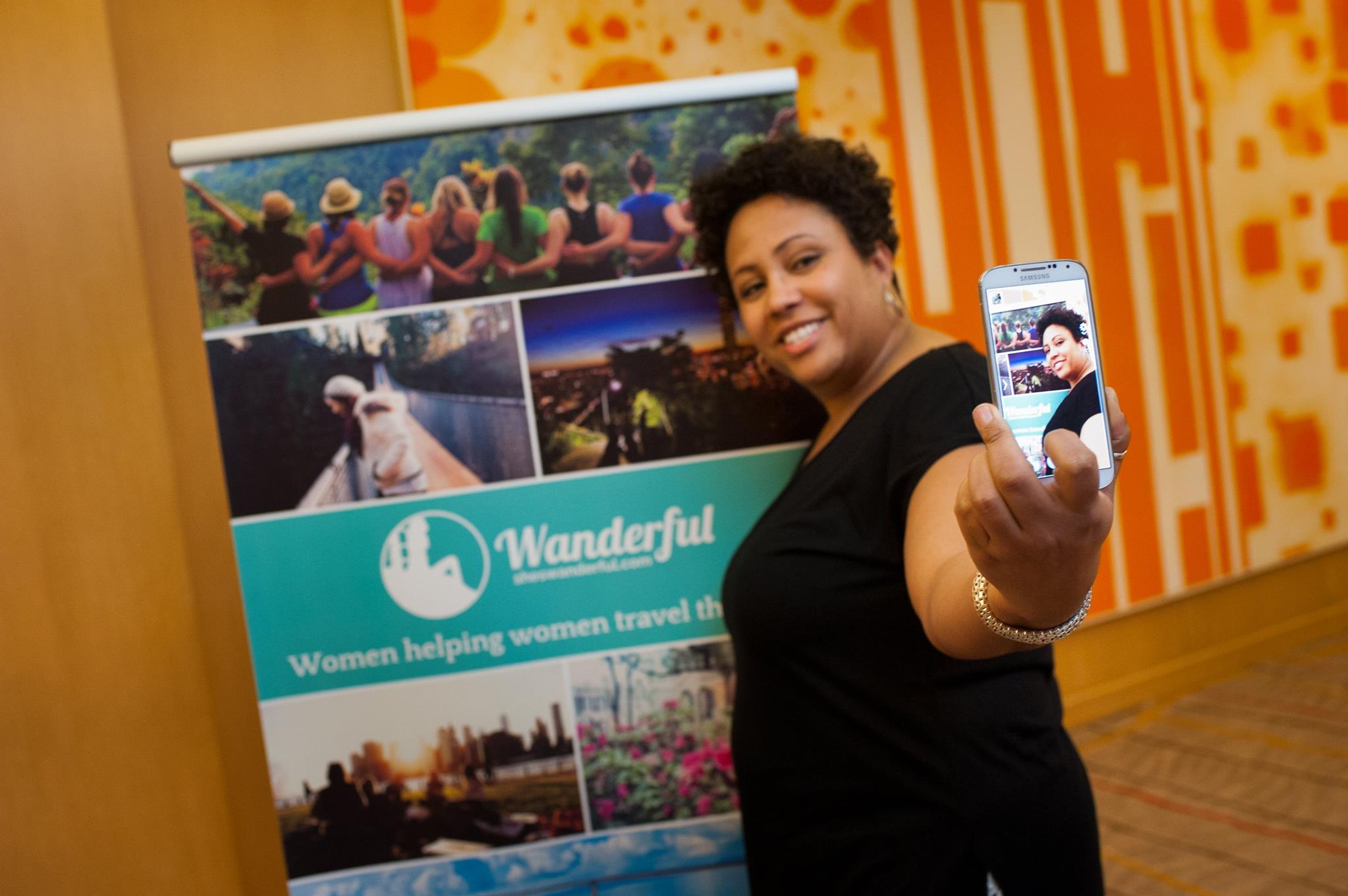travel for black women - taking a selfie at the Women in Travel Summit by Wanderful to stay connected to travel lovers everywhere
